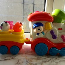 Развивающий паровозик Chicco Музыкальный поезд